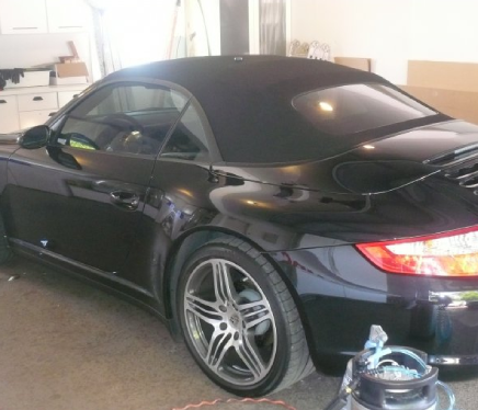 a black vehicle with tinted windows.