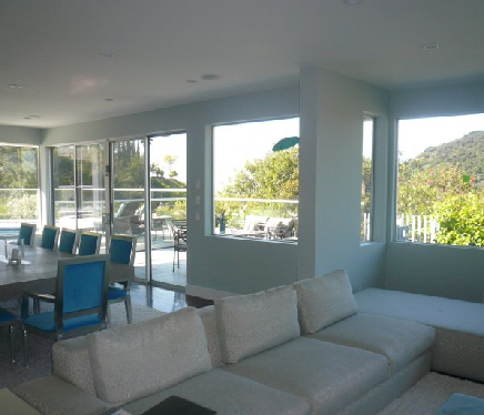 Several windows with tinting help protect furniture inside.