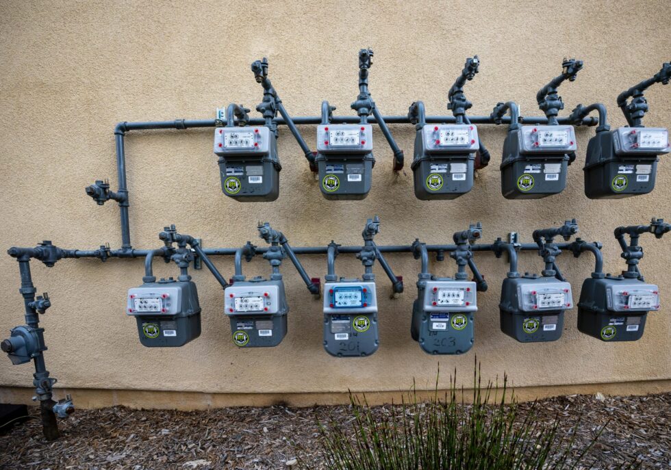 Residential utility meters mounted on an exterior wall
